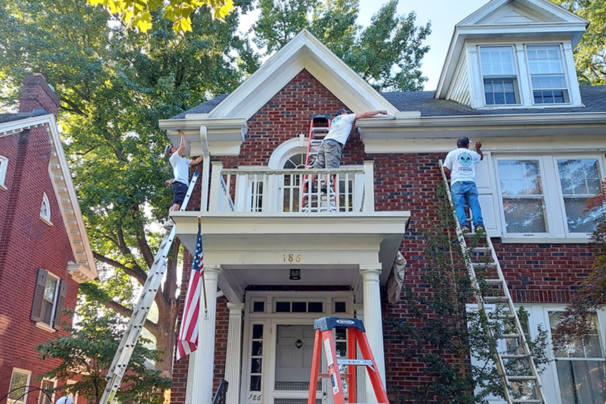 Red brick house with white trim